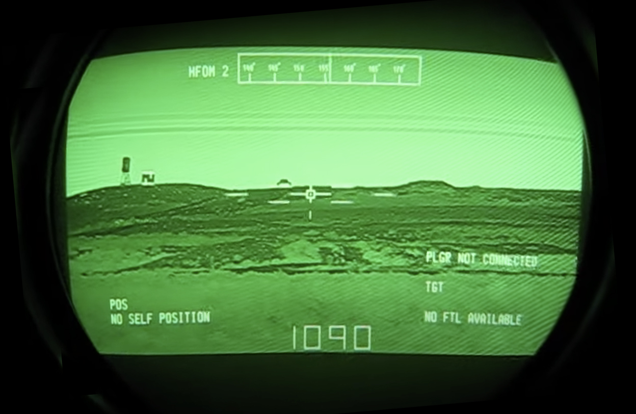 Here is a view looking through a modern M1 tank Thermal Imaging Sight. The older T.I.S. provided less information in the H.U.D., but the reticle and view are essentially the same.